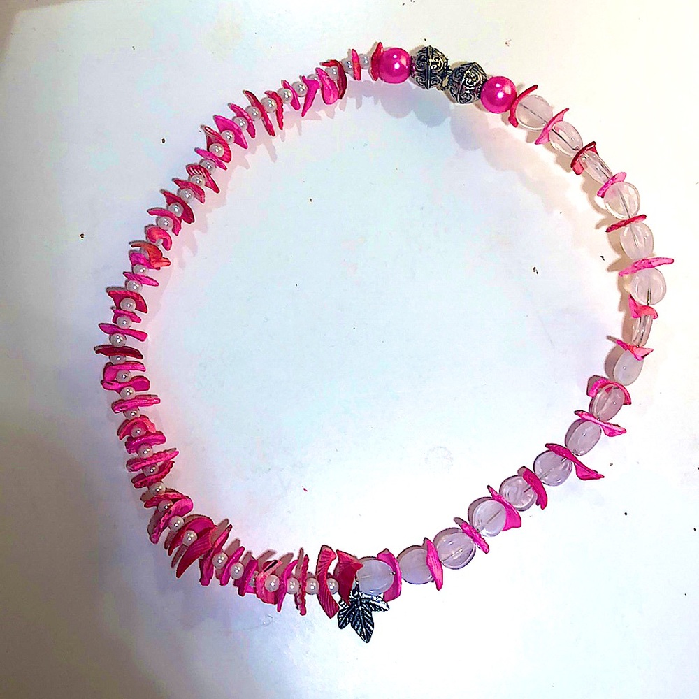 A pink seashell, Pearl necklace